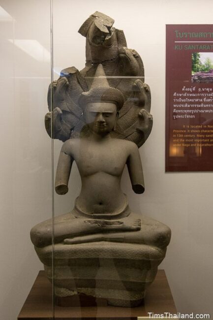 statue of Buddha under a naga