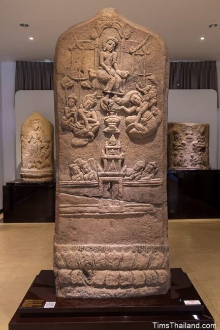 large bai sema boundary stone with Princess Princess Yasodhara cleaning Lord Buddha's feet with her hair