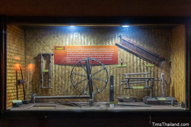 display case with silk weaving equipment in the museum