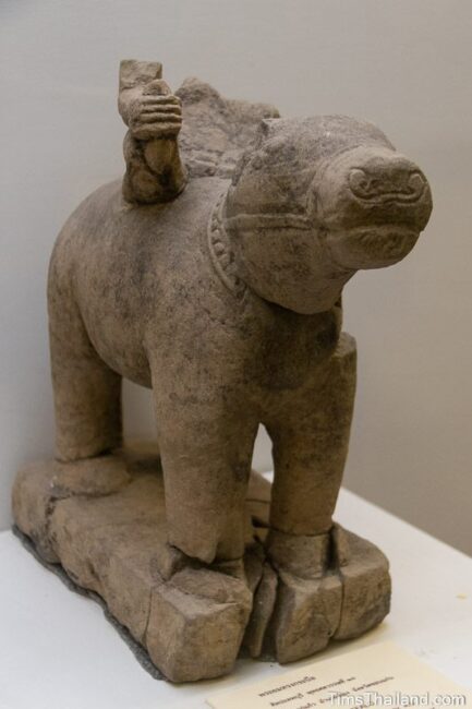 statue of buffalo with broken Yama riding it