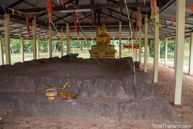 front view of Khmer ruin with Buddha in back