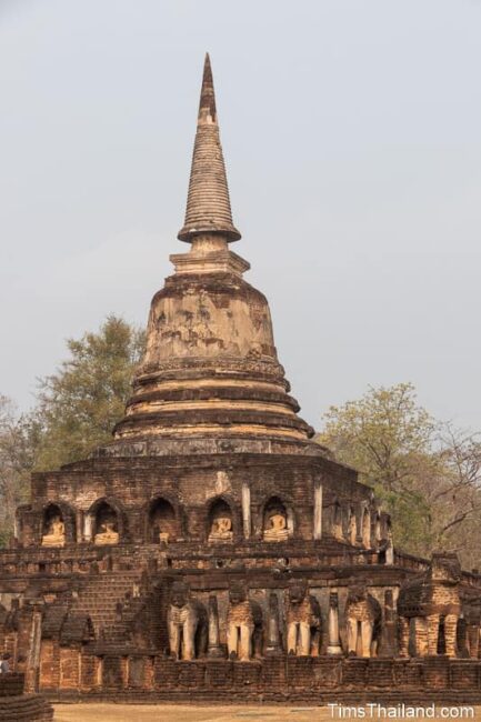 ancient stupa surrounded by elephant statues