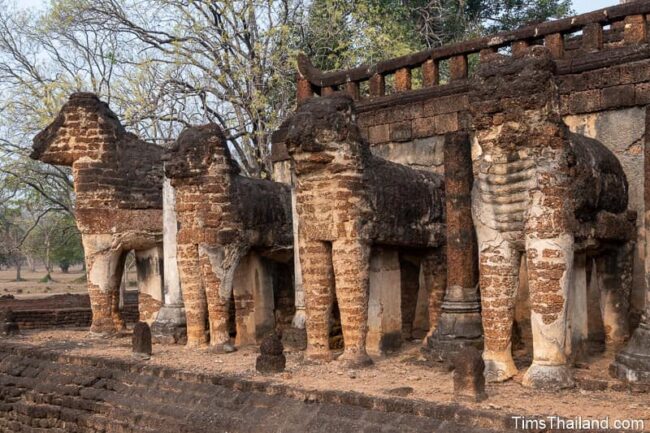 elephant statues at base of ancient stupa