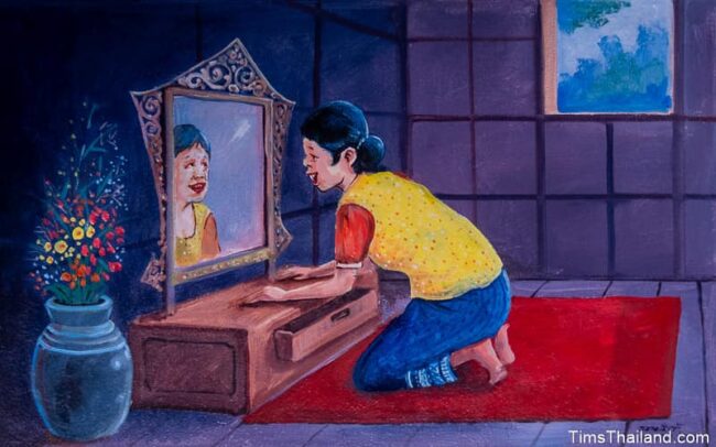 woman looking in mirror