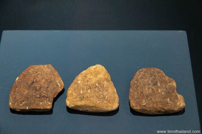 three highly eroded votive tablets