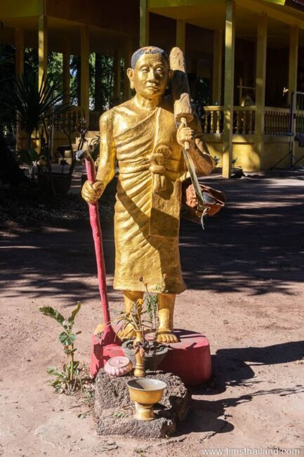 Phra Siwali statue with two laterite blocks in front of it