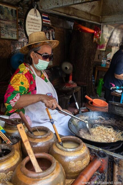 woman cooking pat mee khorat
