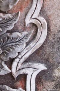 closeup of stucco design at a temple