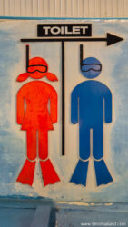 thai bathroom sign with scuba divers